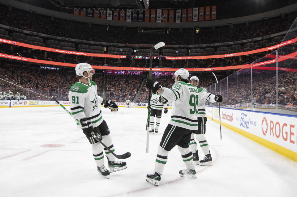 Dallas Stars' Tyler Seguin (91), Matt Duchene (95) and Mason Marchment (27) celebrate a goal against the Edmonton Oilers during the first period of an NHL hockey game Thursday, Nov. 2, 2023, in Edmonton, Alberta. (Jason Franson/The Canadian Press via AP)