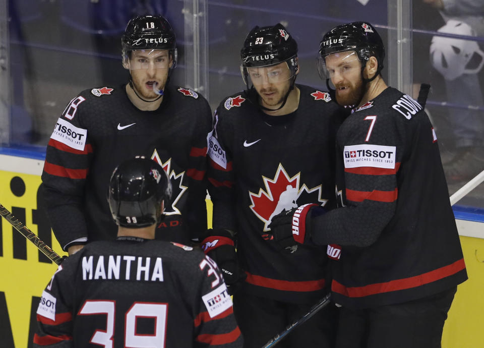 Canada's Sam Reinhart, 2nd right, celebrates with teammates after scoring his sides fourth goal during the Ice Hockey World Championships group A match between Canada and Denmark at the Steel Arena in Kosice, Slovakia, Monday, May 20, 2019. (AP Photo/Petr David Josek)