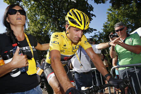 Race leader and yellow jersey holder Trek Factory rider Fabian Cancellara of Switzerland reacts at the end of the 159,5 km (99 miles) third stage of the 102nd Tour de France cycling race from Anvers to Huy, Belgium, July 6, 2015. REUTERS/Benoit Tessier