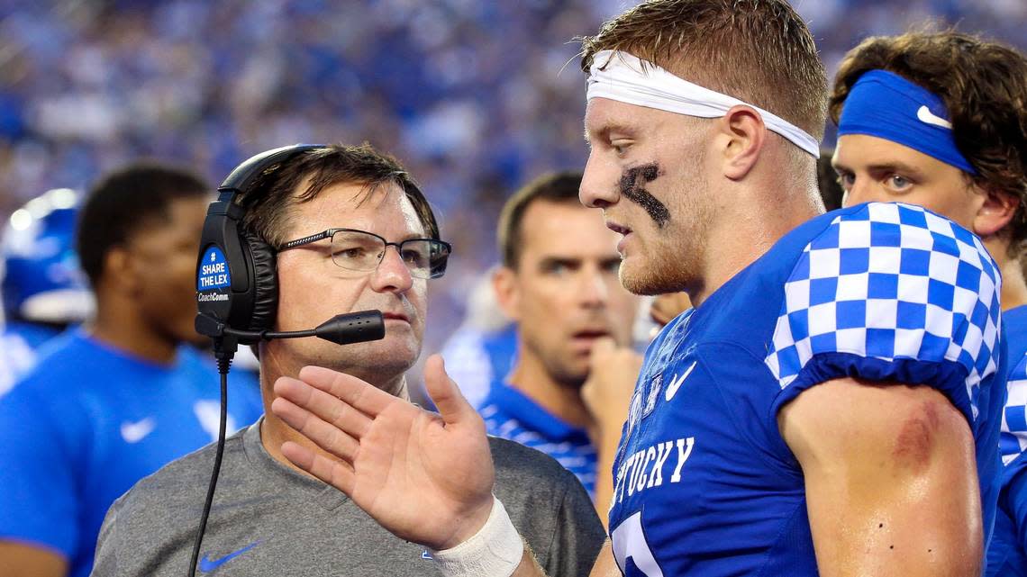 Kentucky offensive coordinator Rich Scangarello, left, talking to UK quarterback Will Levis, will seek to invigorate a Wildcats attack that ranks 112 out of 131 FBS teams in total offense through two games with a average of 312.5 yards per contest.
