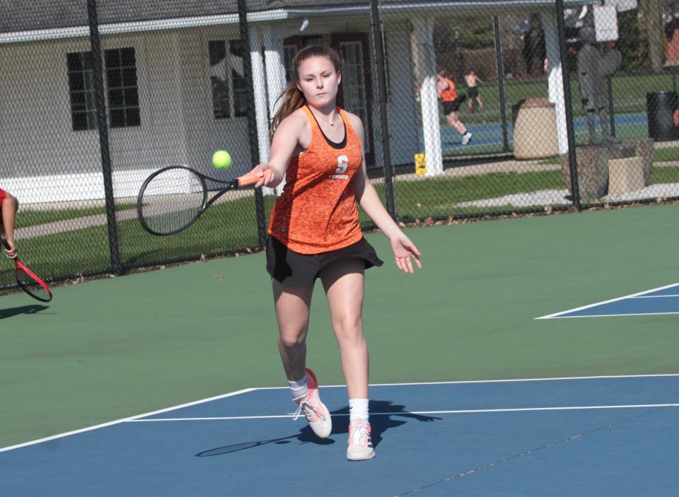 Gracie Perry returns a shot in her match at fourth singles on Wednesday. She won in straight sets, 6-0 and 6-0.