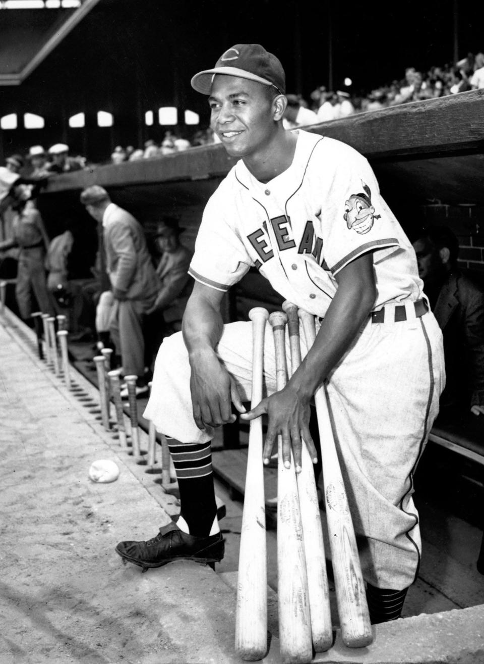 Larry Doby, the first Black player in the American League, poses proudly in his Cleveland uniform in the dugout in Comiskey Park in Chicago, Ill., on July 5, 1947.