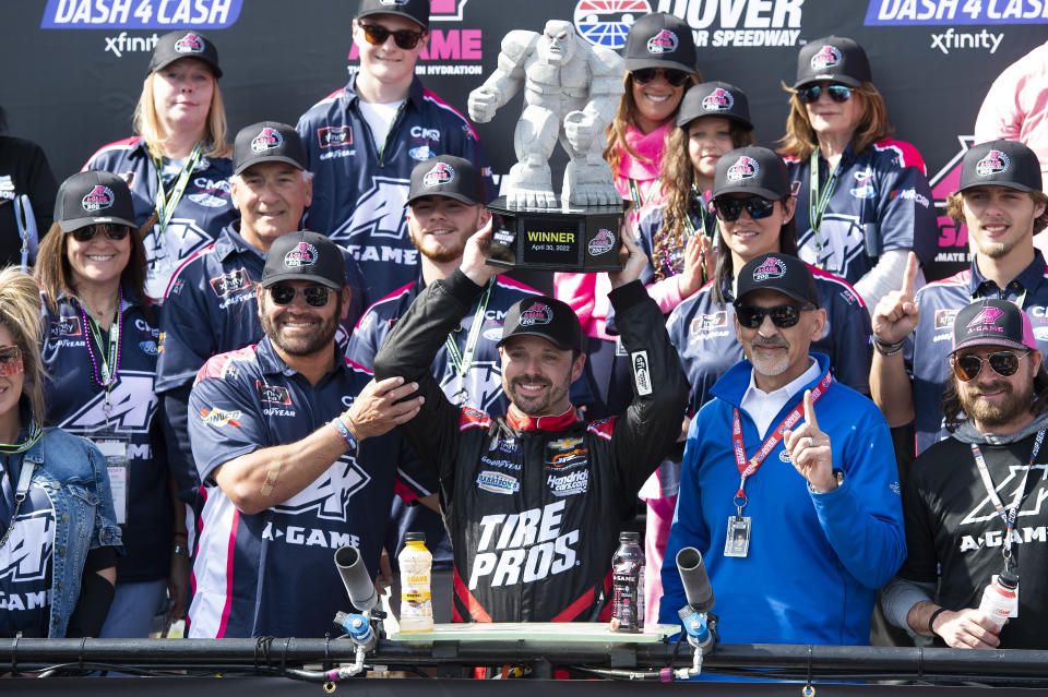 Josh Berry (8) holds up the trophy in Victory Lane after winning the NASCAR Xfinity Series auto race at Dover International Speedway, Saturday, April 30, 2022, in Dover, Del. (AP Photo/Jason Minto)