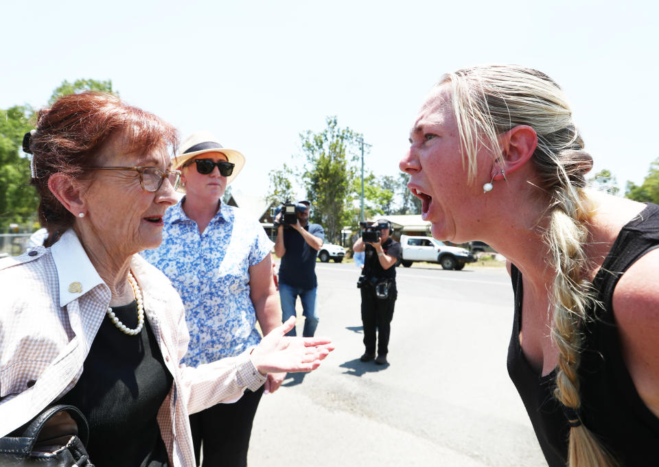 Local Resident Ginger O'Brien shouts at Member for Lismore Janell Saffin in Nimbin. 