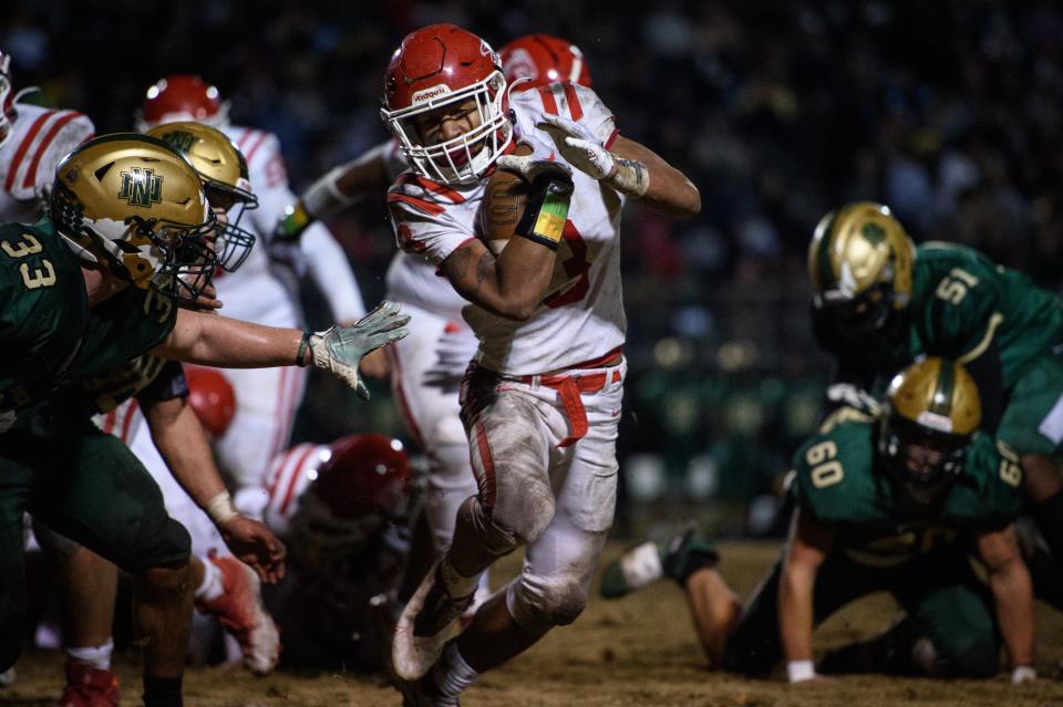 Seventy-First's Anthony Quinn Jr. dodges the grasp of Northern Nash's Conner Baker during the NCHSAA 3A East Regional final on Friday, Dec. 2, 2022. Quinn had two touchdowns in Seventy-First's season-ending loss to Northern Nash.