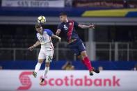 Jul 22, 2017; Arlington, TX, USA; United States midfielder Paul Arriola (20) and Costa Rica defender Francisco Calvo (15) jump for the ball during the second half at AT&T Stadium. The United States shut out Costa Rica 2-0. Mandatory Credit: Jerome Miron-USA TODAY Sports