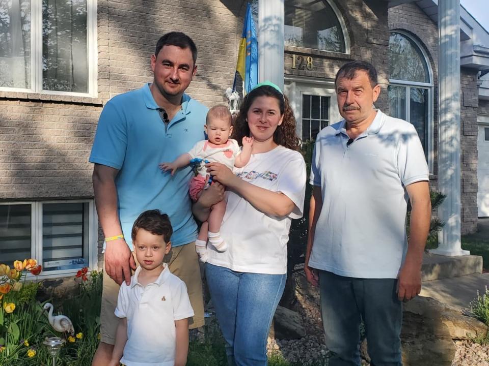 Yaroslav Zahoruyko (far right) has been welcomed into the home of his daughter, Nataliya Zahoruyko, and her husband, Roman Selvester (left) and their children,  Michael and Emiliya. (Kwabena Oduro/CBC - image credit)