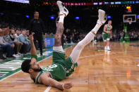 Boston Celtics forward Jayson Tatum hits the floor after a shot against the Miami Heat during the first half of Game 2 of an NBA basketball first-round playoff series, Wednesday, April 24, 2024, in Boston. (AP Photo/Charles Krupa)