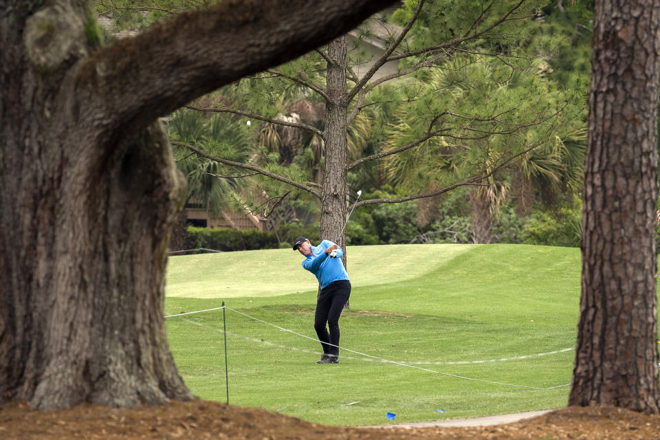 Stewart Cink hits out of the rough on the 10th hole during the second round of the RBC Heritage golf tournament in Hilton Head Island, S.C., Friday, April 16, 2021. (AP Photo/Stephen B. Morton)