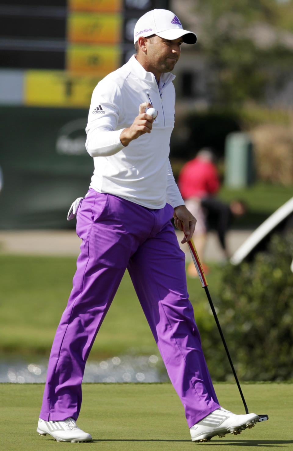 Sergio Garcia waves to the crowd after making par on the 18th hole during the second round of the Houston Open golf tournament, Friday, April 4, 2014, in Humble, Texas. (AP Photo/Patric Schneider)