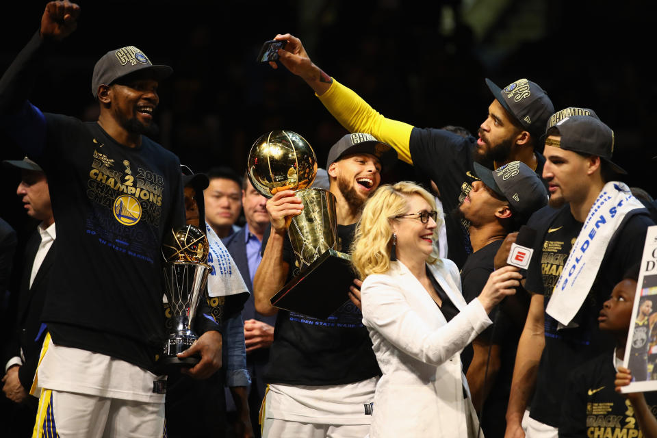 NBA analyst Doris Burke pictured alongside the Golden State Warriors&nbsp;after the team defeated the Cleveland Cavaliers in the 2018 NBA Finals. (Photo: Gregory Shamus via Getty Images)