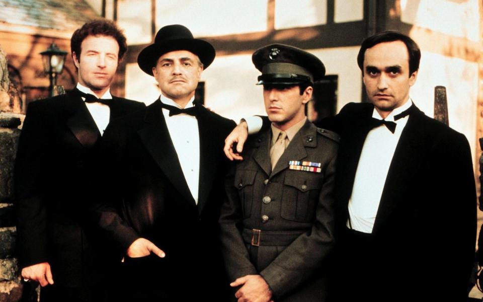 James Caan with, from left, fellow stars of The Godfather (1972), Marlon Brando, Al Pacino and John Cazale - alamy