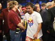 Manny Pacquiao of the Philippines leaves the ring after losing to Floyd Mayweather, Jr. of the U.S. in their welterweight WBO, WBC and WBA (Super) title fight in Las Vegas, Nevada, May 2, 2015. REUTERS/Steve Marcus