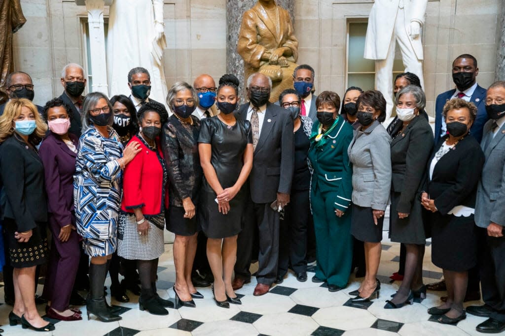 Representative-elect Shontel Brown (D-OH) poses for a photo with Rep. James Clyburn (D-SC) and the Congressional Black Caucus in Statuary Hall at the U.S. Capitol on November 4, 2021 in Washington, DC. (Photo by Sarah Silbiger/Getty Images)