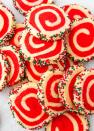 <p>These easy pinwheel cookies are beyond mesmerizing but also so easy to make. Make a batch of our easy <a href="https://www.delish.com/cooking/recipe-ideas/recipes/a50502/basic-sugar-cookies-recipe/" rel="nofollow noopener" target="_blank" data-ylk="slk:sugar cookie dough;elm:context_link;itc:0;sec:content-canvas" class="link ">sugar cookie dough</a>, then dye one half red. Then simply roll them together to create the swirl. The sprinkles are optional but they add so much extra fun!</p><p>Get the <strong><a href="https://www.delish.com/holiday-recipes/christmas/a30210803/christmas-pinwheel-cookies-recipe/" rel="nofollow noopener" target="_blank" data-ylk="slk:Christmas Pinwheel Cookies recipe;elm:context_link;itc:0;sec:content-canvas" class="link ">Christmas Pinwheel Cookies recipe</a></strong>.</p>