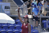 Naomi Osaka, of Japan, waves after winning her match during the first round of the tennis competition at the 2020 Summer Olympics, Sunday, July 25, 2021, in Tokyo, Japan. (AP Photo/Seth Wenig)