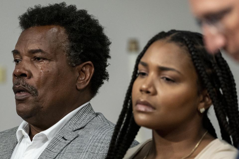 Garnell Whitfield, left, takes a deep breath, as he listens during a press conference , Wednesday, July 12, 2023, in Buffalo, N.Y. Victims and relatives of last year's mass shooting at a Buffalo supermarket announced Wednesday they are suing the social media sites, weapons retailers and others who they say “loaded the gun” the assailant used to kill 10 Black people and wound three other victims in an attack fueled by racist conspiracy theories he encountered online. (Libby March/The Buffalo News via AP)