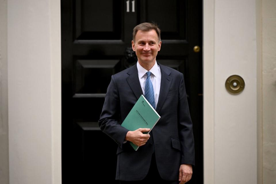 Jeremy Hunt holding his Autumn Statement for Growth (Getty Images)