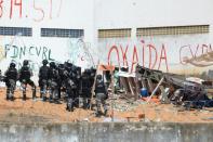 Brazilian riot police stormed the Alcacuz Penitentiary Center to stop a deadly gang face-off in the overcrowded prison