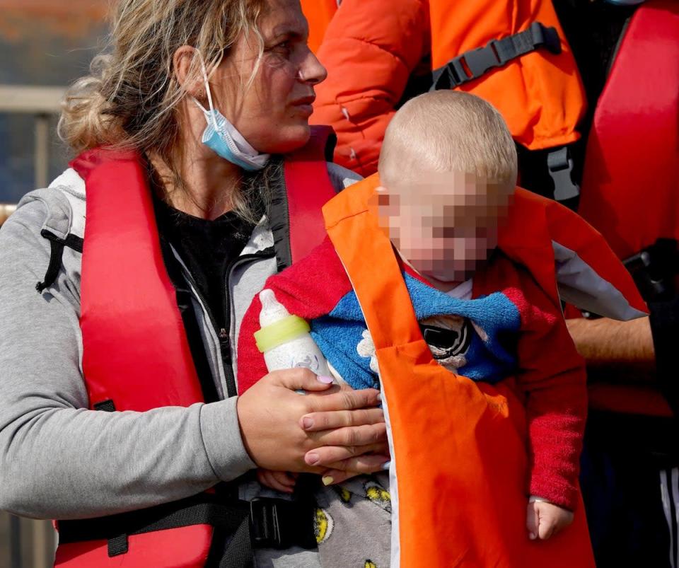 A young child in pyjamas was among the 221 people who made the crossing on Friday (Gareth Fuller/PA) (PA Wire)