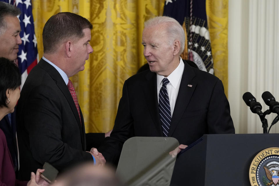 President Joe Biden shakes hands with outgoing Sec. of Labor Marty Walsh, during a ceremony announcing his nomination of Julie Su to serve as the Secretary of Labor during an event in the East Room of the White House in Washington, Wednesday, March 1, 2023. (AP Photo/Susan Walsh)