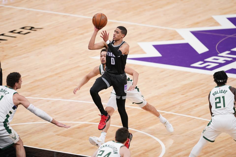 Kings guard Tyrese Haliburton, an alumnus of Oshkosh North,  goes up for a shot amongst a quartet of Bucks defenders in the first quarter.