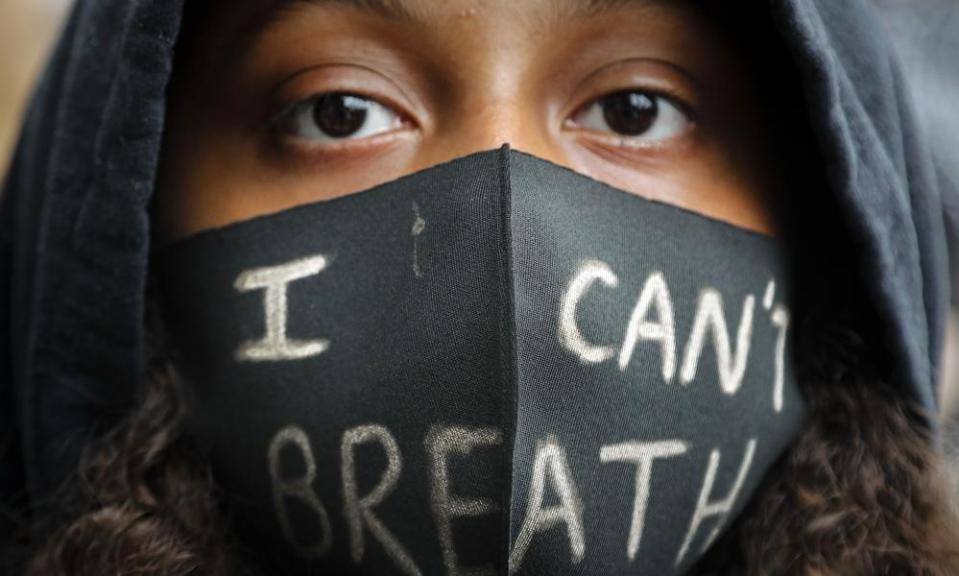 A protester’s face mask in London echoes the final words of George Floyd.