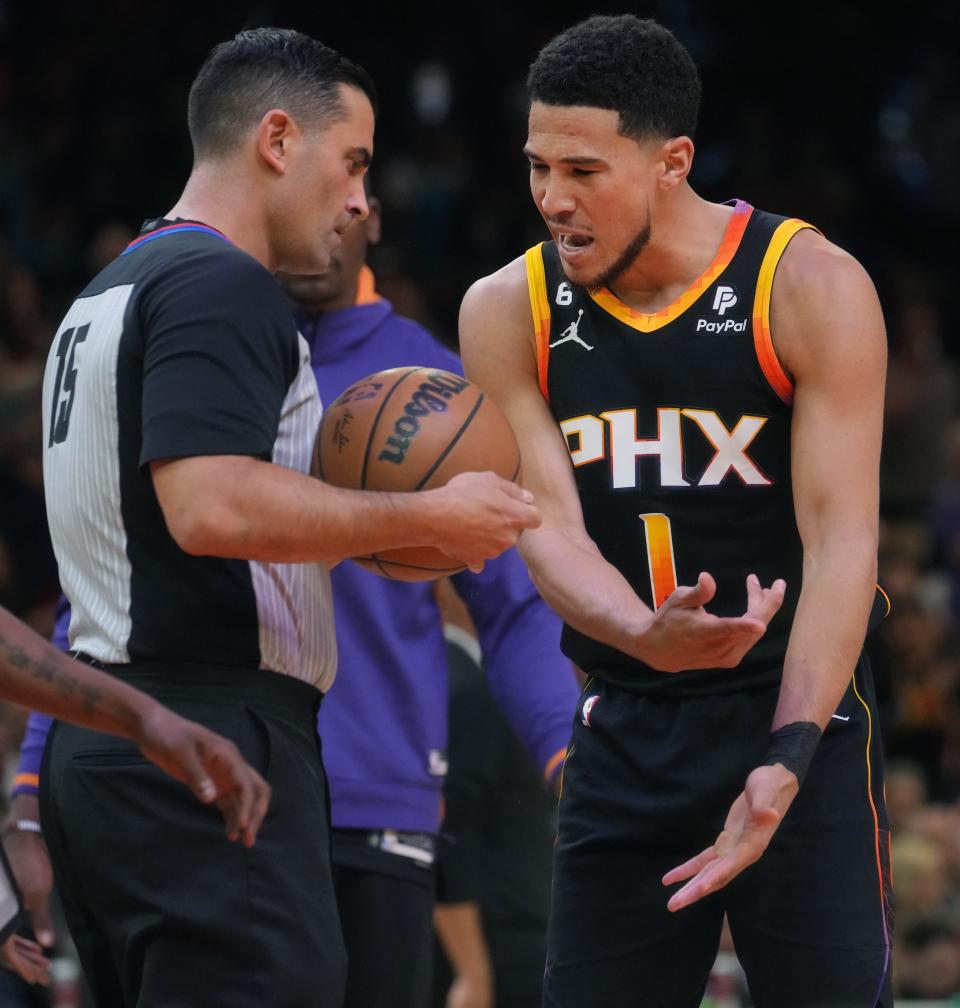 Phoenix Suns guard Devin Booker (1) argues for a foul call with the referee as they take on the Denver Nuggets during Game 3 of the Western Conference Semifinals at the Footprint Center in Phoenix on May 5, 2023.