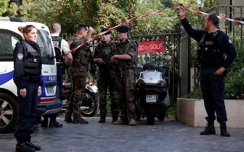 Police and soldiers secure the scene where French soliders were hit and injured by a vehicle in the western Paris suburb of Levallois-Perret - Credit: REUTERS/Benoit Tessier