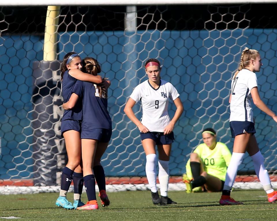 Hanover’s Sophia Foley celebrates her goal with Hanover’s Eva Kelliher that gave Hanover the 1-0 lead during first half action of their game against Plymouth North at Hanover High on Thursday, Sept. 15, 2022.