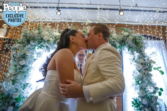 <p>Alfonso Lozano</p> Ciara Schirripa and Zach Binder kiss after saying "I do."