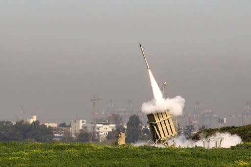 An Israeli missile is launched from the Iron Dome missile system in the city of Ashdod in response to a rocket launch from the nearby Palestinian Gaza Strip. New Israeli air strikes on the Gaza killed three Palestinians on Sunday, raising the death toll in a latest round of violence to 18, as militants fired over 120 rockets into Israel