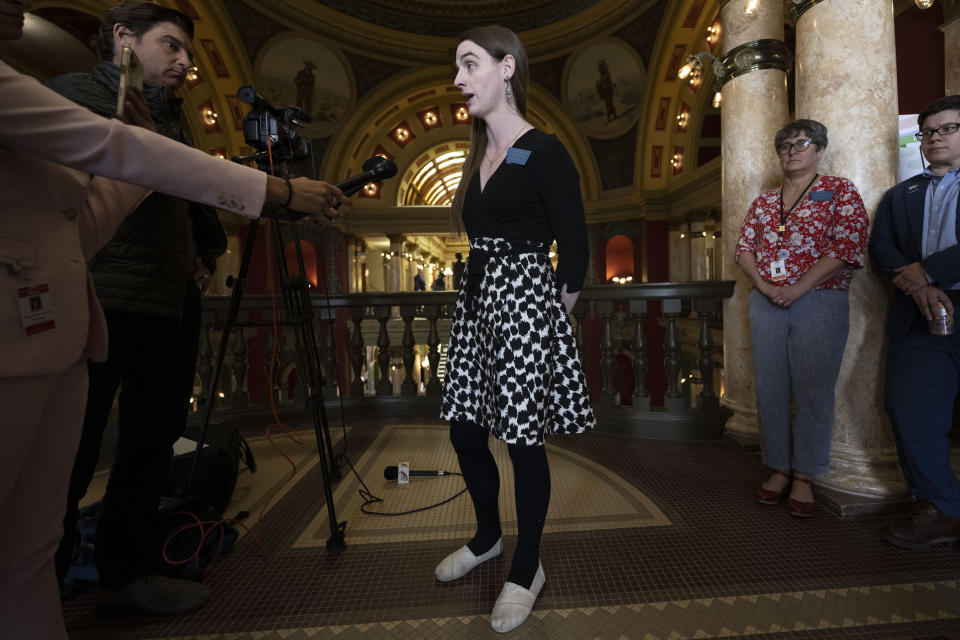 Rep. Zooey Zephyr talks with the media after a House of Representatives session at the Montana State Capitol in Helena, Mont., on Wednesday, April 26, 2023. (AP Photo/Tommy Martino)