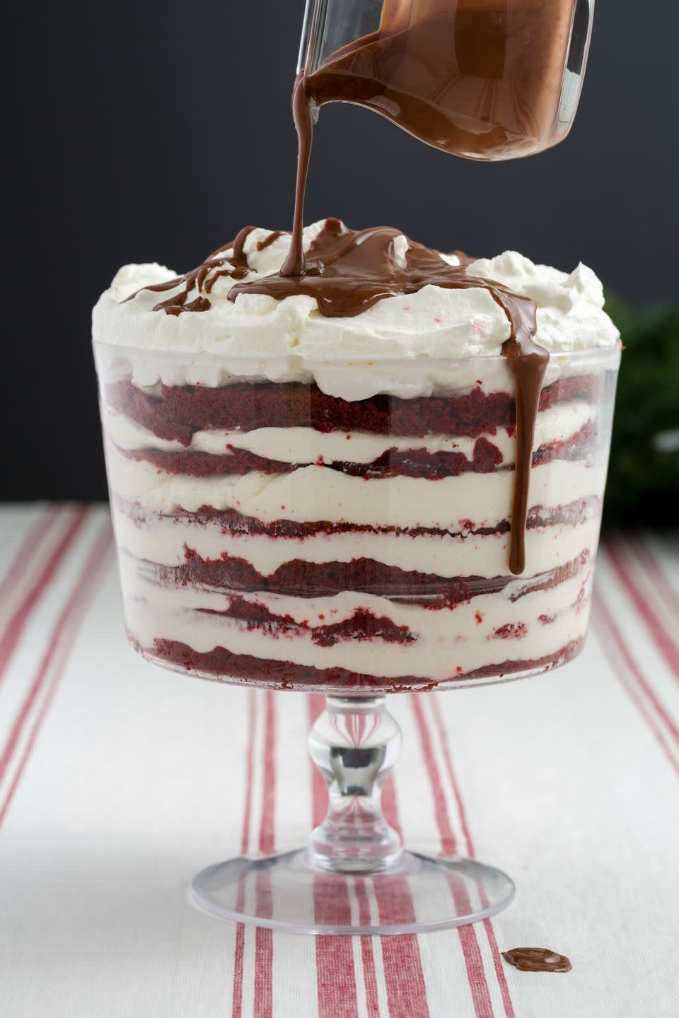 <p>The best gift you can give to guests is red velvet and ganache.</p><p>Get the recipe from <a href="https://www.delish.com/cooking/recipe-ideas/recipes/a45319/red-velvet-trifle-recipe/" rel="nofollow noopener" target="_blank" data-ylk="slk:Delish;elm:context_link;itc:0;sec:content-canvas" class="link ">Delish</a>. </p>