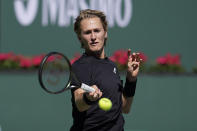 Sebastian Korda returns a shot to Rafael Nadal, of Spain, at the BNP Paribas Open tennis tournament Saturday, March 12, 2022, in Indian Wells, Calif. (AP Photo/Marcio Jose Sanchez)