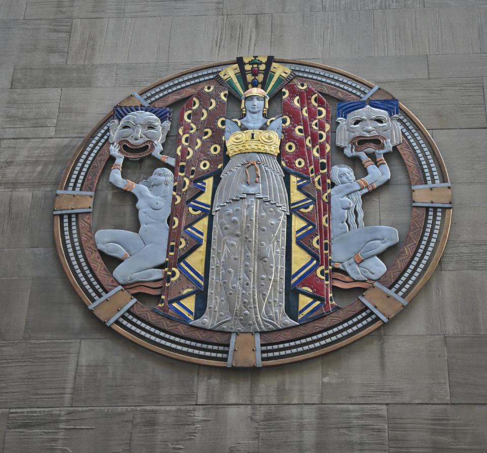 In this March 24, 2014 photo, the colossal metal-and-enamel roundel created by art deco muralist Hildreth Meiere stands out on the facade of Radio City Music Hall in New York. “The Art Deco Murals of Hildreth Meiere,” a new book on the trail-blazing muralist who completed over 100 commissions in 16 states before her death in 1961, is set for May 1. (AP Photo/Bebeto Matthews)