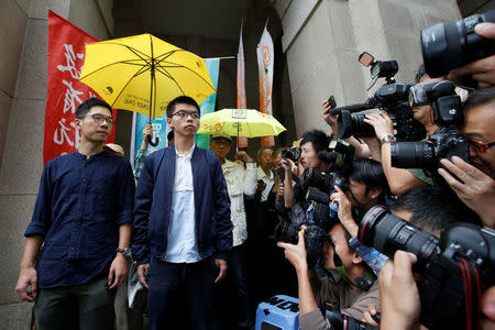 Pro-democracy activists Joshua Wong (R) and Nathan Law arrive at the Court of Final Appeal in Hong Kong, China November 7, 2017. REUTERS/Bobby Yip