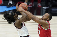 Illinois's Ayo Dosunmu (11) is tied up by Ohio State's Zed Key (23) during the first half of an NCAA college basketball championship game at the Big Ten Conference tournament, Sunday, March 14, 2021, in Indianapolis. (AP Photo/Darron Cummings)