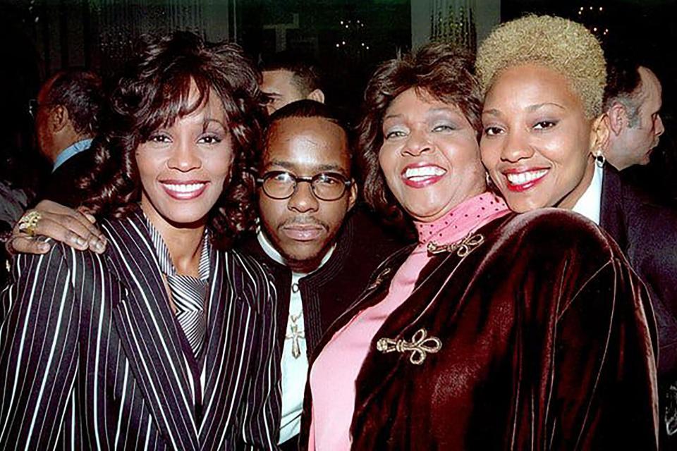 Whitney Houston, Bobby Brown and Robyn Crawford (far right) (MediaPunch/Shutterstock)