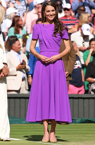 <p>Karwai Tang/WireImage</p> Catherine Princess of Wales on court to present the trophy to the winner of the men's final on day fourteen of the Wimbledon Tennis Championships at the All England Lawn Tennis and Croquet Club on July 14, 2024 in London