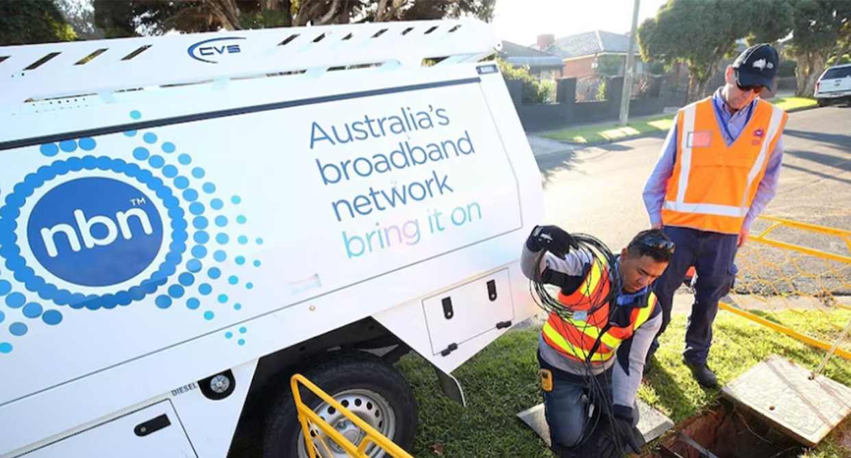 NBN employees installing the broadband service on a suburban Aussie street. 