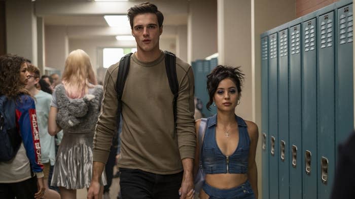 Nate and Maddie walking hand-in-hand down their school hallway