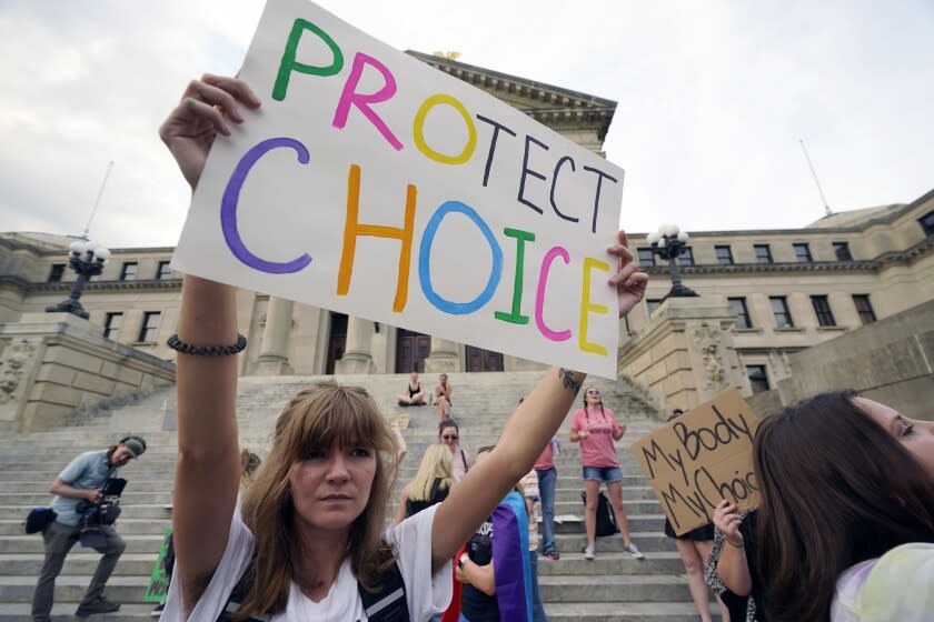 FILE - An abortion-rights supporter protests at the Mississippi Capitol on June 28, 2022, in Jackson, Miss. A California doctor is proposing a floating abortion clinic in the Gulf of Mexico as a way to maintain access for people in southern states where abortion bans have been enacted. (AP Photo/Rogelio V. Solis, File)