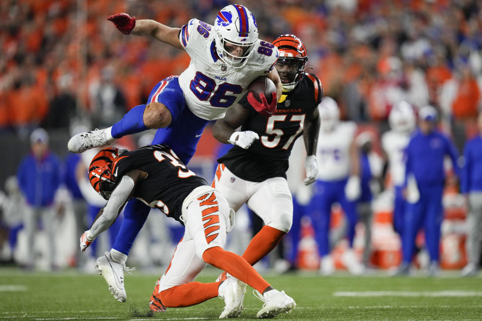 Cincinnati Bengals safety Nick Scott, bottom, makes a hit on Buffalo Bills tight end Dalton Kincaid (86) during the second half of an NFL football game, Sunday, Nov. 5, 2023, in Cincinnati. Kincaid fumbled the ball on the play and Scott recovered the ball. (AP Photo/Carolyn Kaster)