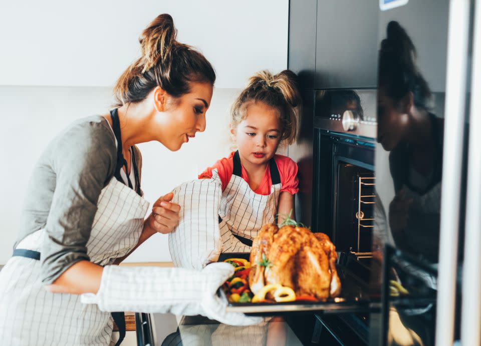 For the perfect combo, stuffing goes in the neck, aromatics go in the cavity. Photo: Getty