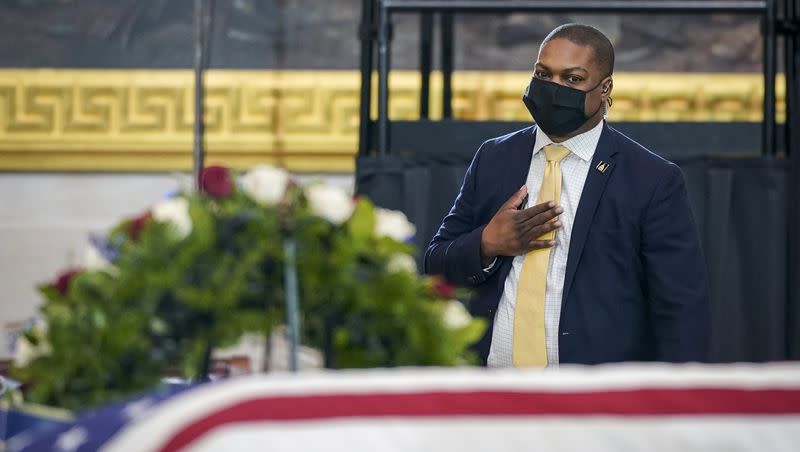 U.S. Capitol Police officer Eugene Goodman pays his respects to the late fellow officer William “Billy” Evans, who lies in honor in the Rotunda at the U.S. Capitol on Tuesday, April 13, 2021, in Washington.