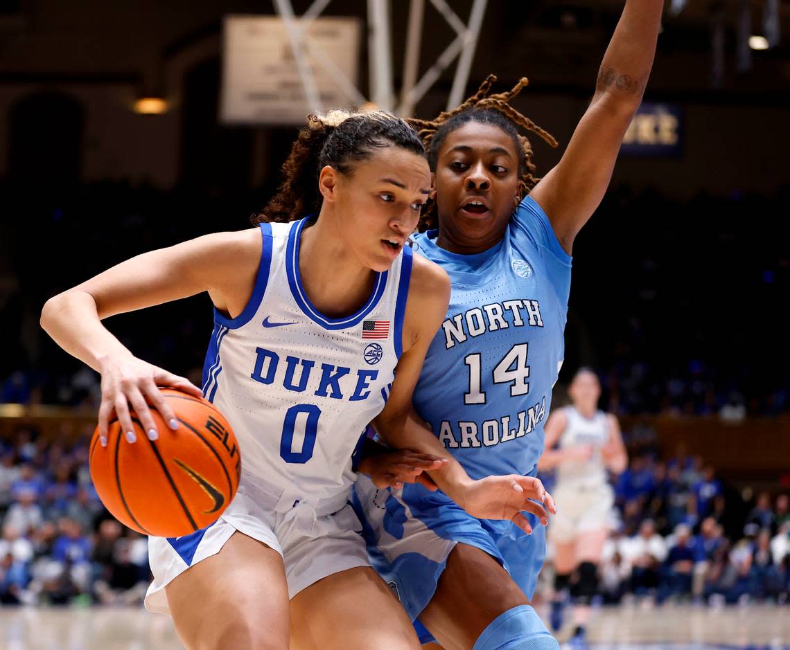 Duke’s Celeste Taylor drives past North Carolina’s Kayla McPherson during the first half of the Tar Heels’ 45-41 win over Duke on Sunday, Feb. 26, 2023, at Cameron Indoor Stadium in Durham, N.C.