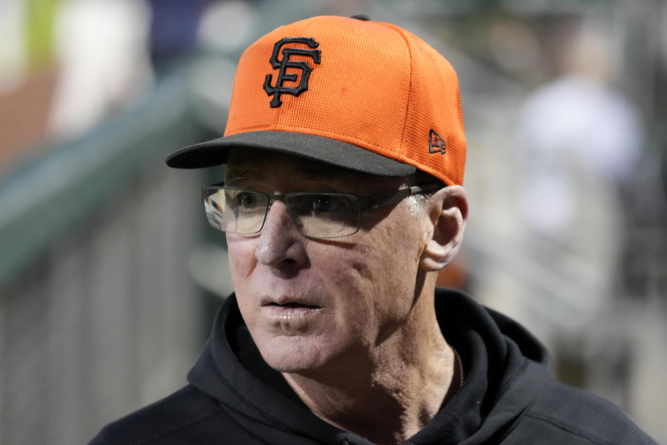 San Francisco Giants manager Bob Melvin pauses in the dugout prior to a spring training baseball game against the Los Angeles Dodgers Thursday, March 7, 2024, in Scottsdale, Ariz. (AP Photo/Ross D. Franklin)