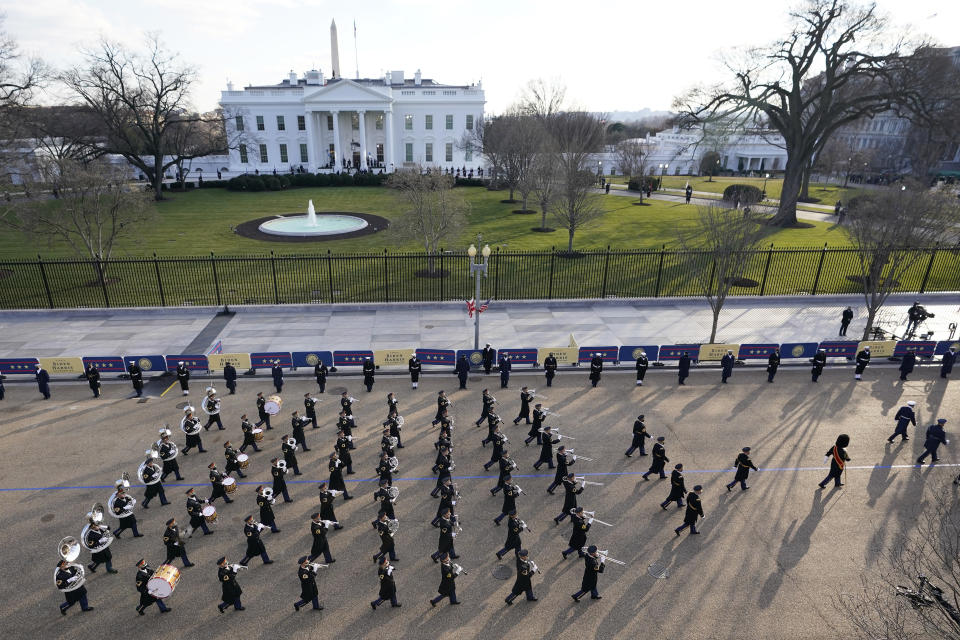 A U.S. Army band marches near the White House during the Presidential Escort, part of Inauguration Day ceremonies, Wednesday, Jan. 20, 2021, in Washington. (AP Photo/David J. Phillip)