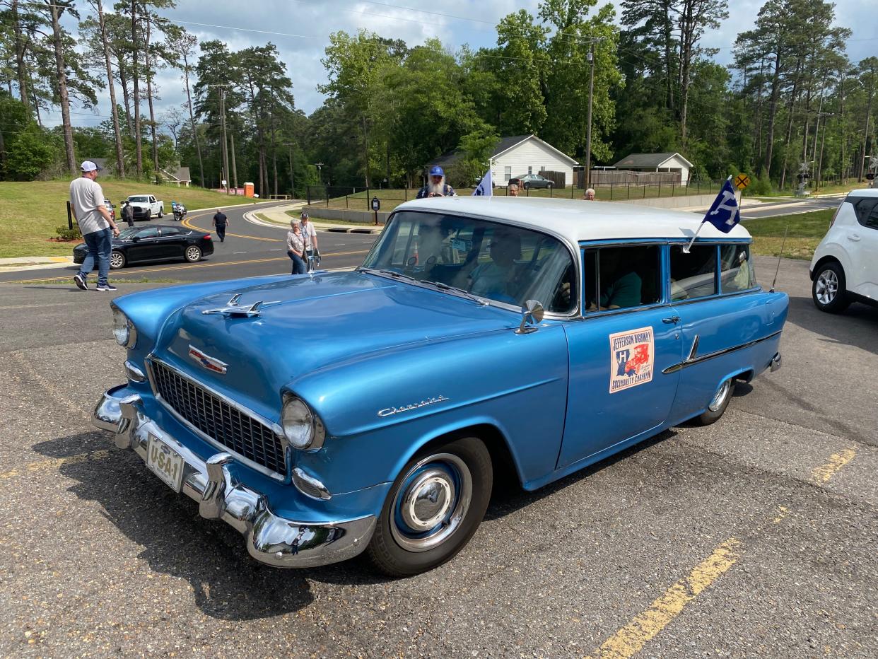 Jane and Bill Johnson from Lexington, Ky., drove their light blue 1955 Chevy station wagon to Alexandria for the Jefferson Highway Association Conference and also to the Jefferson Highway sign dedication in Pineville. The couple drove the entire length of the historic highway from its start in Winnipeg, Manitoba, Canada to its end in New Orleans in the car two years ago. The Jefferson Highway can be seen behind the car.